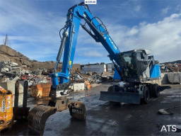 Fuchs MHL 320 S5 Material handler with grab. Watch Video
